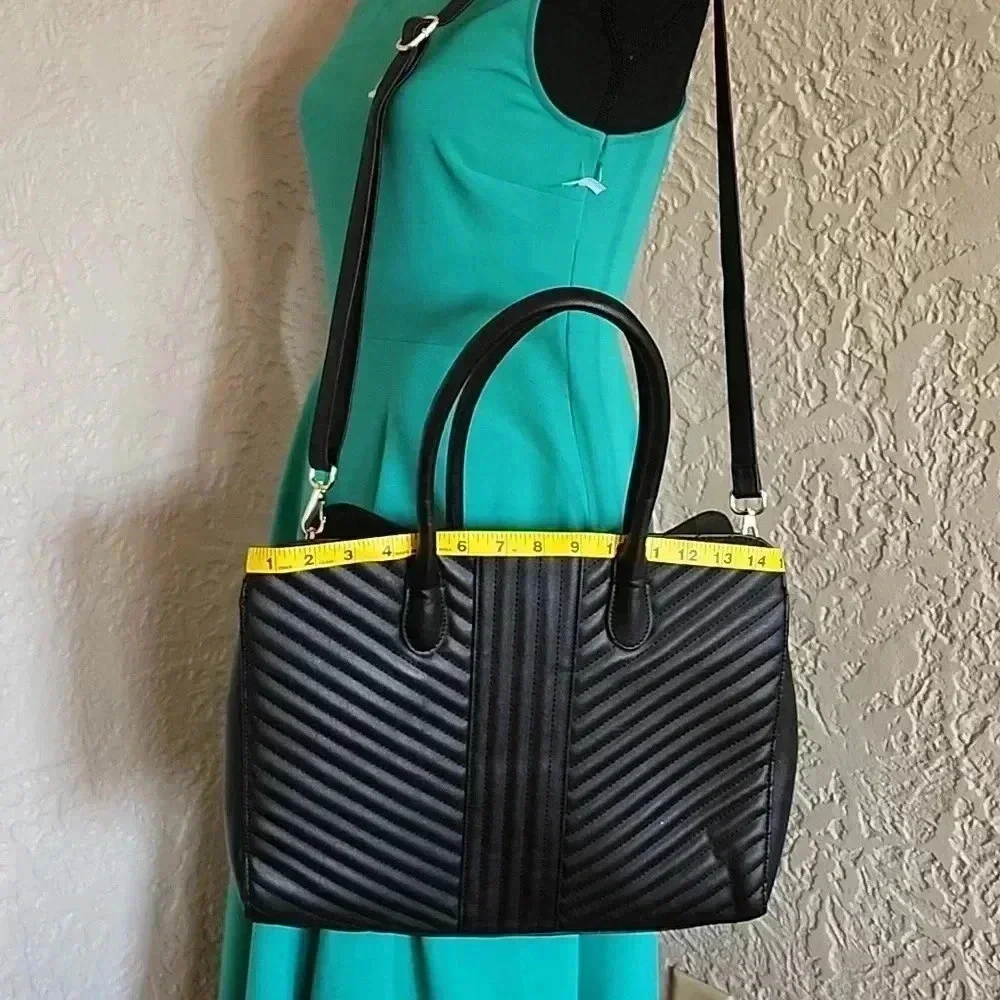 A new day tm.large bag great for laptop 💻 like new use only at few times.